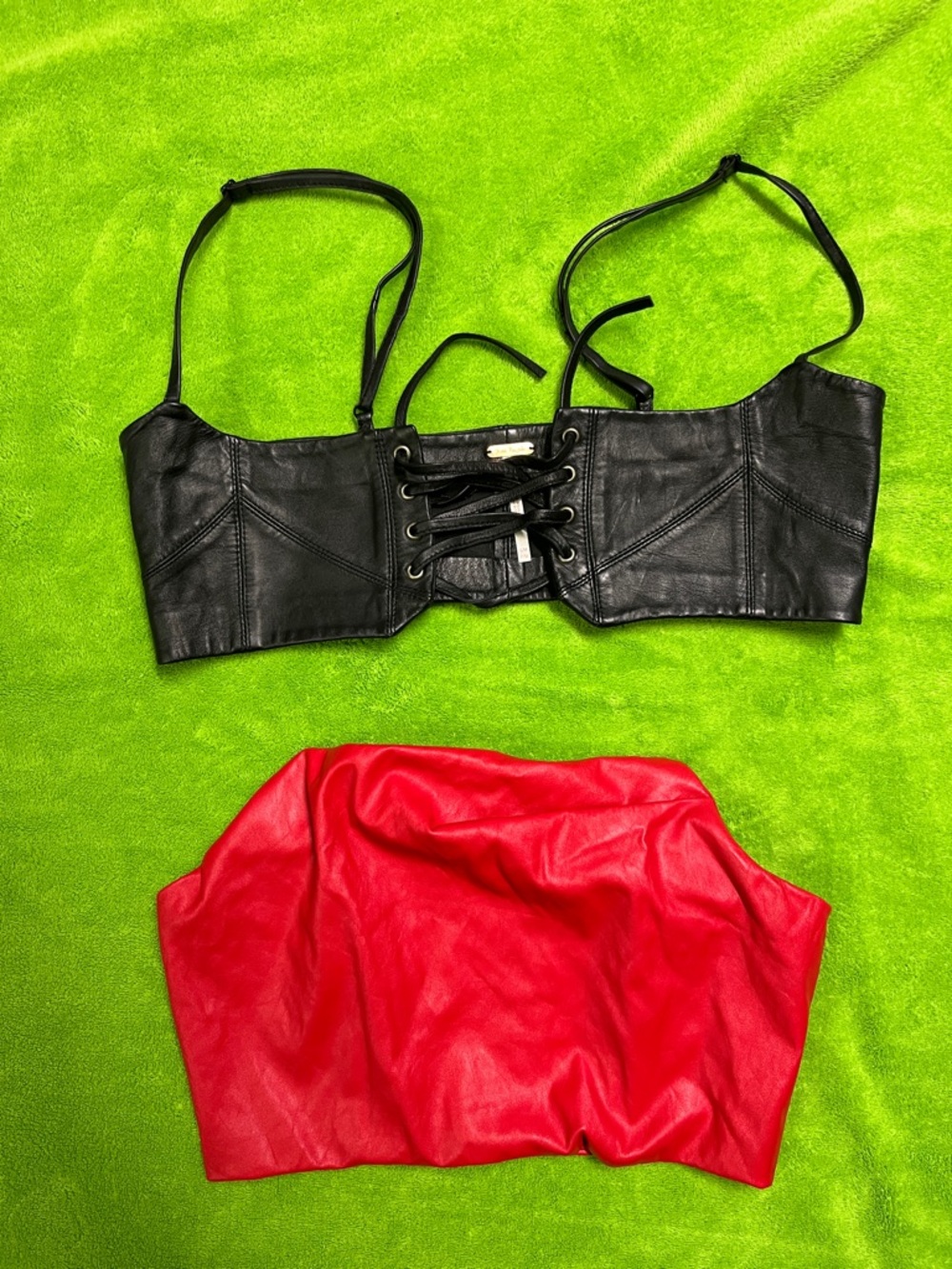 Black Leather Lace-Up Bustier and Red Pleather Tube Top with zippered back.